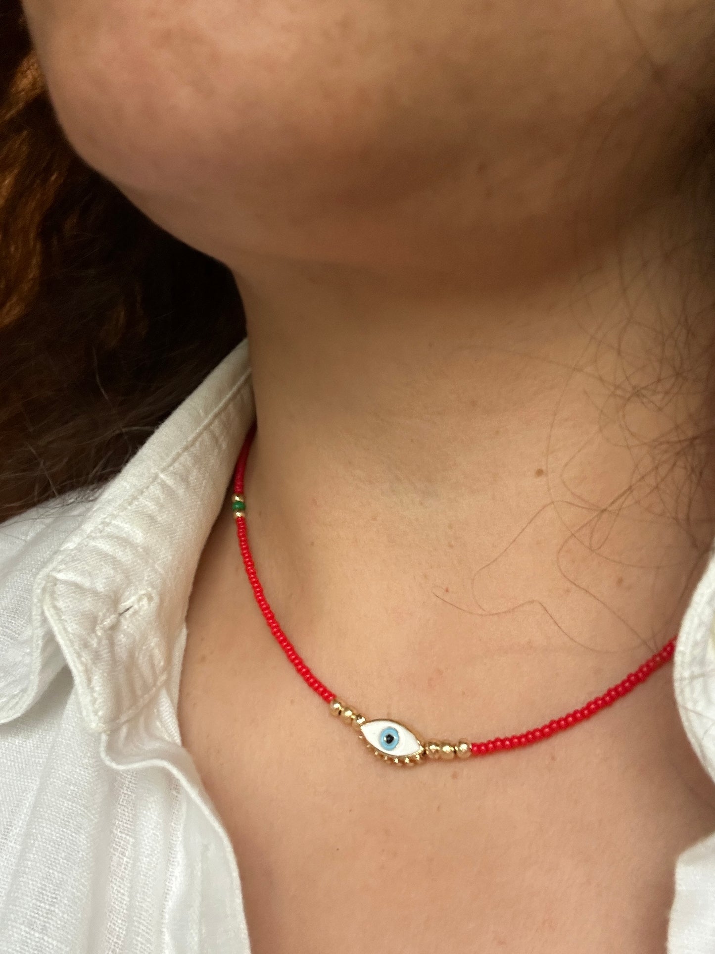 Gold plated evil eye necklace 14 inches red beads